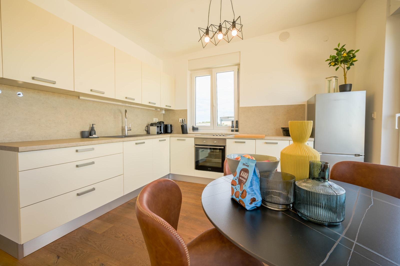 Full kitchen view with dining table